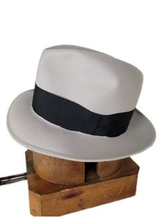 Elevate your style with this beautiful high crown vintage men's Knox Premier Fedora Hat. Crafted from high-quality materials, this hat is the perfect addition to any wardrobe. With its classic design, versatile light gray color, tall crown make it a must-have for any fashion-forward individual who wants to make a statement. Its timeless design and superior craftsmanship ensure that it will be a staple in your wardrobe for years to come. Invest in this vintage accessory today and add a touch of s Vintage Gray Hat, Vintage High Crown Hat For Formal Occasions, James Cagney, Hat Blocks, Fedora Hat, Beautiful Lights, Vintage Accessories, Vintage Men, Fedora