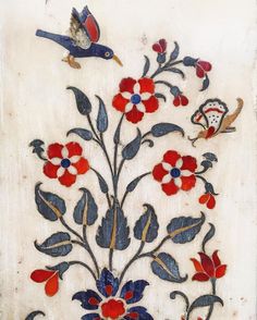 an embroidered piece with flowers and birds on white paper, possibly from the late 19th century