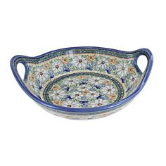 a blue and white bowl with flowers on it