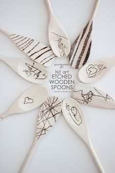 four spoons are arranged in the shape of a flower with words written on them