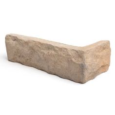 a stone bench sitting on top of a white floor