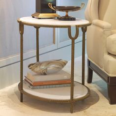 a table with books on it and a chair in the background