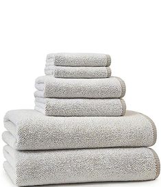 six white towels stacked on top of each other