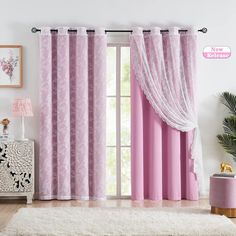 a living room with pink curtains and white rugs on the floor, in front of a window