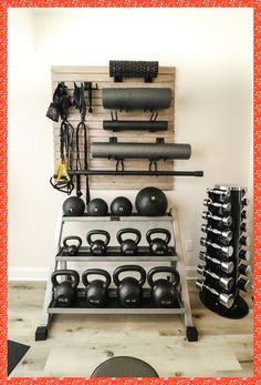 there is a rack full of kettles and exercise equipment