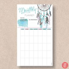 the printable planner is shown with watercolor feathers and dream catchers on it