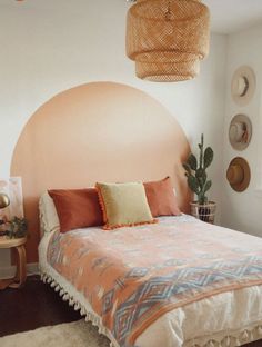 a bedroom with a bed, lamps and rugs