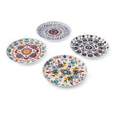 four plates with different designs on them