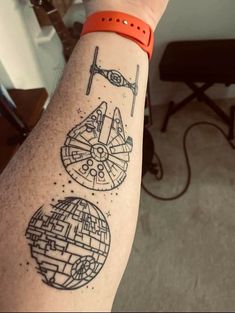 a person with a tattoo on their arm that has star wars drawings on it and the words,