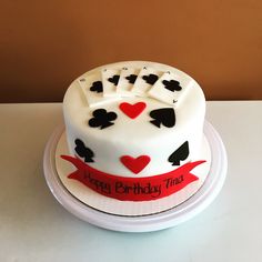 a birthday cake with playing cards on it