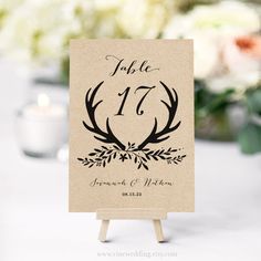 a table number card with antlers on it