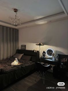 a bedroom with a bed, desk and lamp on the wall next to a window