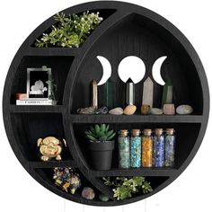 a black shelf filled with lots of different items