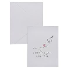 a greeting card with a kite flying in the sky and an envelope that says sending you a paper hug