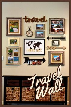 a wall filled with pictures and framed photos next to wicker baskets on top of a wooden table