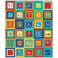 a colorful quilt with letters and numbers on it