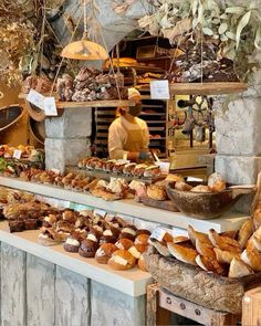 a bakery filled with lots of bread and pastries