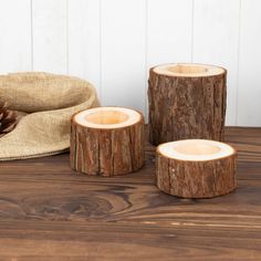 three pieces of wood sitting on top of a wooden table next to a burlock bag