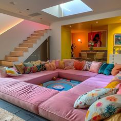 a living room filled with lots of colorful pillows