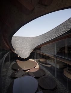 the interior of a building with large circular windows