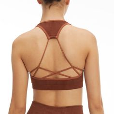 New Year, New You. Meet The Seamless Strappy Back Rib Bra. Innovative Workout Fabrication For The Smoothest Shape And Fit Yet. Pair It With The Seamless Ribbed Legging For The Full Look. Square Neckline Strap Back Ribbed Textured Seamless Construction Medium Support Padded Brown Color 93% Nylon 7% Elastane Care: Machine Wash Cold Gentle Cycle. Tumble Dry Low S/M Order Size 1/2 Brown Stretch Crop Top With Built-in Bra, Fitted Seamless Brown Sports Bra, Fitted Brown Seamless Sports Bra, Brown Seamless Stretch Activewear, Brown Seamless Activewear, Strappy Seamless Yoga Crop Top, Seamless Strappy Yoga Crop Top, Strappy Stretch Seamless Crop Top, Stretch Strappy Seamless Crop Top