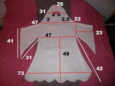 the measurements for a baby's dress are shown in red and white, with numbers on it