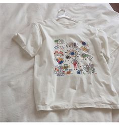 Name: color graffiti, white large size top, loose tide T-shirt short sleeve topMaterial:cottonColor:whiteFeatures:color graffitiSize(cm) :M,L,XL,2XL 1inch=2.54cmM:shoulder:46,bust:94,sleeve:20,length:60,Recommended weight:42kg-49kgL:shoulder:48,bust:98,sleeve:21,length:62,Recommended weight:50kg-56kg&ltp&gtXL:shoulder:50,bust:102,sleeve:22,length:64,Recommended weight:561kg-62kg</p>&ltbr/>&ltp&gt2XL:shoulder:52,bust:106,sleeve:23,length:66,Recommended weight:62kg-69k White Casual T-shirt With Cartoon Print, Casual White T-shirt With Cartoon Print, White Relaxed Fit T-shirt With Graffiti Print, Trendy White T-shirt With Cartoon Print, Artistic White Summer T-shirt, White T-shirt With Cartoon Print For Spring, Trendy White Printed T-shirt, White Artsy Graffiti Print Top, Artsy White Graffiti Print Top