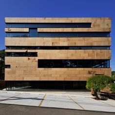 the building is made out of wood and has many windows