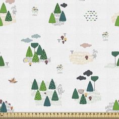 a white fabric with trees and clouds on it