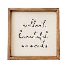 a wooden frame with the words collect beautiful moments written in cursive writing on it