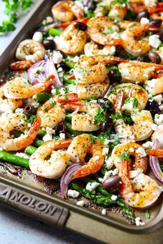 a sheet pan filled with shrimp and vegetables