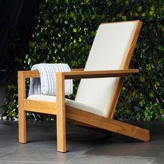 a wooden chair sitting on top of a tile floor