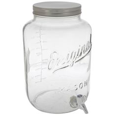 a large glass jar with a metal lid and screwdriver on the top is shown