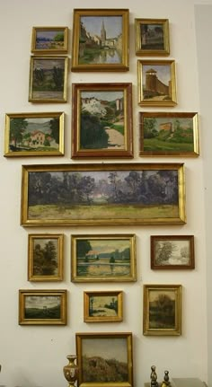 there are many paintings on the wall