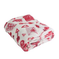 a blanket with red and white designs on it