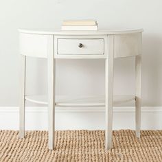 a white table with a book on top