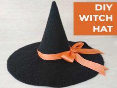 a black witches hat with orange ribbon on the front and bottom, which reads diy witch hat