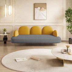 a living room filled with furniture next to a white rug on top of a hard wood floor