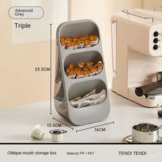 an image of a coffee maker with three trays on it