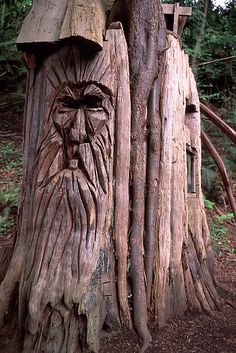 a tree stump with a face carved into it