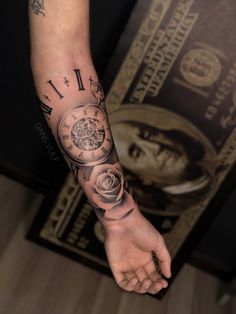 a person's arm with a clock and rose tattoo on the left side of their arm