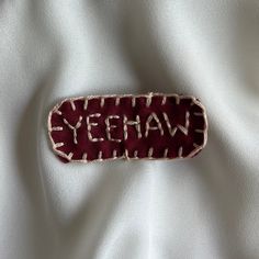 a piece of cloth with the word yeehaw written on it