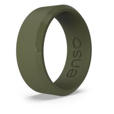 an olive green ceramic ring with the word,'oeso'engraved on it