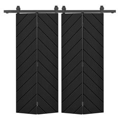 two black doors with an arrow pattern on them