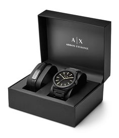 From AX Armani Exchange&#x2C; this watch features:black IP stainless steel braceletblack IP stainless steel round casematte black sunray dial with beveled index ring and gold-tone indexesquartz analog movementapprox. 44mm case size; 22mm bracelet width5 ATM water resistanceblack leather strap with logo-engraved black IP bar plaque includedImported. Watch Leather Strap, Gift Box For Men, Men's Watches Luxury, Black Leather Watch, Armani Exchange Men, Watch Gifts, Luxury Watches For Men, Black Stainless Steel, Armani Exchange