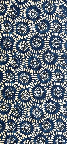 a blue and white pattern on fabric