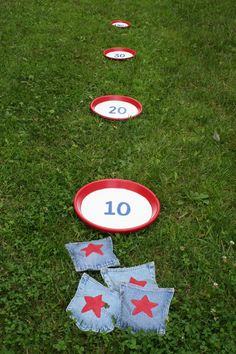 some red white and blue frisbees sitting in the grass