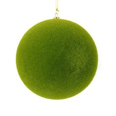 a green ball ornament hanging from a gold chain on a white background with clippings