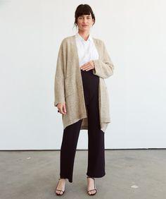 A soft and chic layering essential that promises both cute outfits and the dreamiest cuddles.Fabric Lightweight sweater knit alpaca blend with a super soft, fluffy surface texture. Fit Extra wide, loose silhouette that drapes beautifully.Stage Pregnancy → Postpartum. Stealthy snaps make it nursing-friendly. One Size Soft Knit Outerwear For Loungewear, One Size Soft Knit Loungewear Outerwear, Cozy Fit Super Soft Outerwear For Fall, Super Soft Cozy Fit Outerwear For Fall, Soft Knit Outerwear For Loungewear, One Size, Winter Soft Texture Cardigan For Loungewear, Super Soft Fall Outerwear For Loungewear, Cream Knit Outerwear For Loungewear, Chic Everyday Soft Knit Cardigan