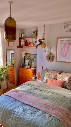 a bed sitting in a bedroom next to a window